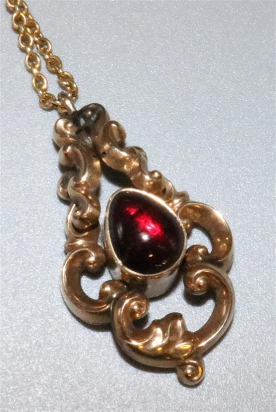 Gold and garnet pendant and chain